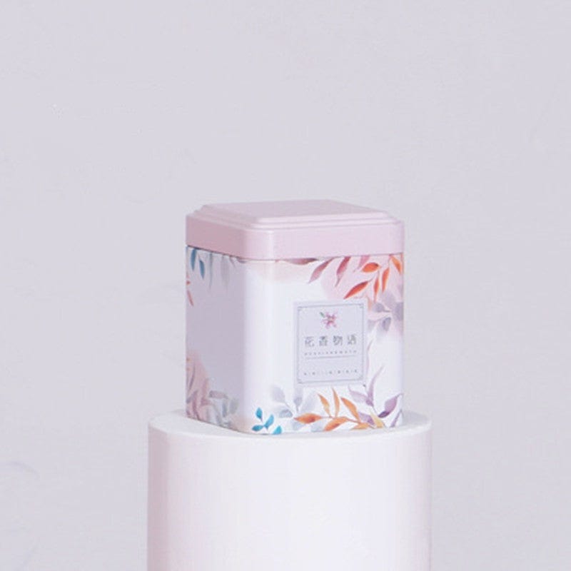 Rosa Metall-Teedose mit Blumen