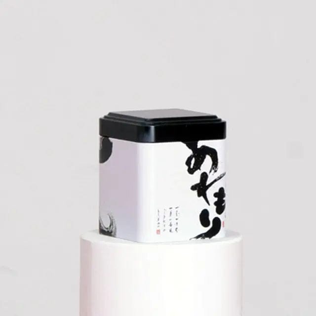 Schwarz-weiße Metall-Teedose