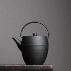 Schwarze japanische Gusseisen-Teekanne 1,1L