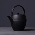 Schwarze japanische Gusseisen-Teekanne 1,1L
